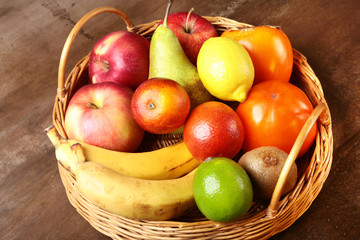 Fresh mixed exotic fruits in basket. Fruits background. Healthy eating, dieting.