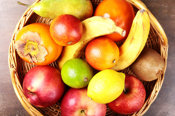 Fresh mixed exotic fruits in basket. Fruits background. Healthy eating, dieting.