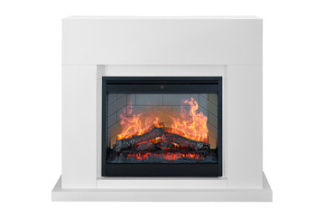 White wooden burning fireplace with roaring flames. Isolated on white background, clipping path included. Fireplace as a piece of furniture