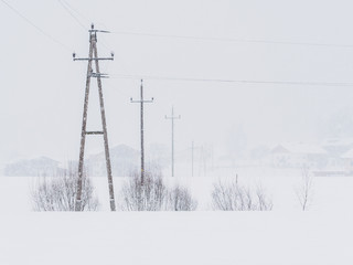 Power lines in the snowstorm in Ebbs, Tirol, Austria