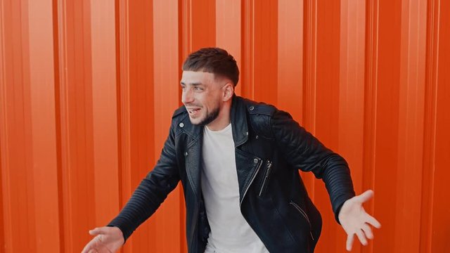 stylish bearded male jerks like a nervous paralytic or got electric shock