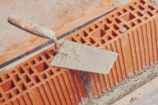 Construction throwel  tool on a sand / cement.
