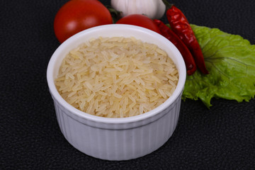 Raw uncooked rice in the bowl