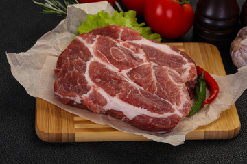 Raw pork neck steak