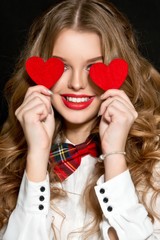 Valentine's Day. Beautiful girl with heart. Woman with red heart. 