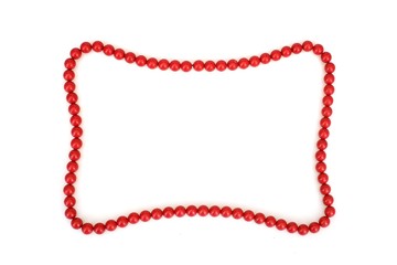Red beads in the form of a frame for text or image isolated on white background