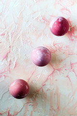 Pink easter eggs on the pink background.