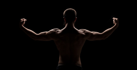 strong athletic mans back isolated