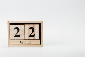 Wooden calendar April 22 on a white background