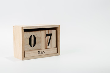 Wooden calendar May 07 on a white background