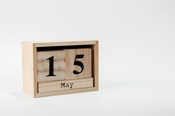 Wooden calendar May 15 on a white background
