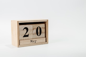 Wooden calendar May 20 on a white background