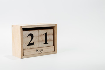 Wooden calendar May 21 on a white background