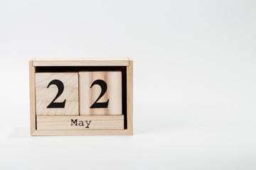 Wooden calendar May 22 on a white background