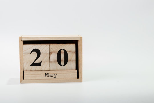 Wooden calendar May 20 on a white background