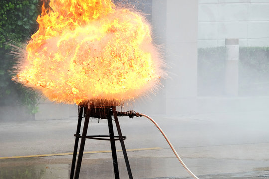 Fire explosion on the kitchenware, outdoors, prepared in a fire drill
