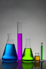 Liquid in laboratory bottles. Scientific biochemical laboratory. Colorful liquid.