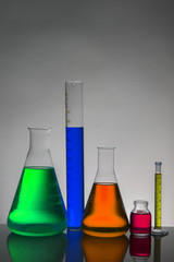 Liquid in laboratory bottles. Scientific biochemical laboratory. Colorful liquid.