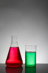 Liquid in laboratory bottles. Scientific biochemical laboratory. Colorful liquid.