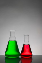 Liquid in laboratory bottles. Scientific biochemical laboratory. Colorful liquid.