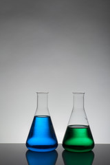 Liquid in laboratory bottles. Scientific biochemical laboratory. Colorful liquid.