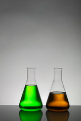 Liquid in laboratory bottles. Scientific biochemical laboratory. Colorful liquid.
