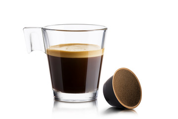 Black coffee in glass cup with coffee waffle on white background