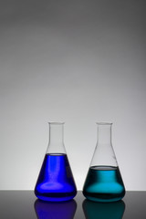 Liquid in laboratory bottles. Scientific biochemical laboratory. Colorful liquid.