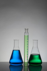 Liquid in laboratory bottles. Scientific biochemical laboratory. Colorful liquid.