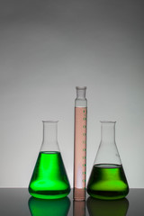 Liquid in laboratory bottles. Scientific biochemical laboratory. Colorful liquid.