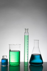 Liquid in laboratory bottles. Scientific biochemical laboratory. Colorful liquid.