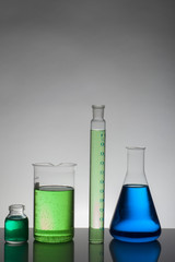 Liquid in laboratory bottles. Scientific biochemical laboratory. Colorful liquid.