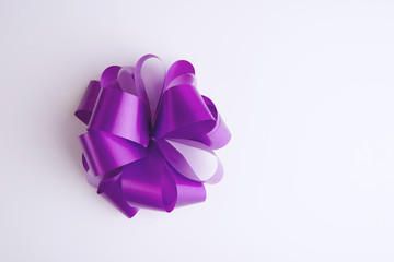 Smooth violet ribbon beam on white background.