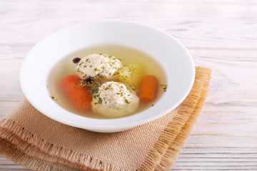 Chicken meatballs soup with carrot and potato