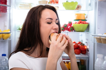 Smiling Woman Looking At Burger