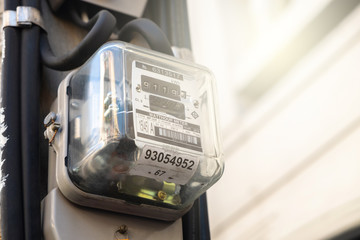 Electric Watthour Meter in the Front of House. Electronic Energy Meter Utility Monitor
