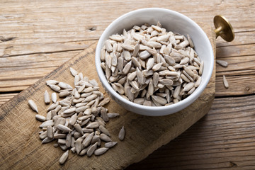 Sunflower seeds on wood background