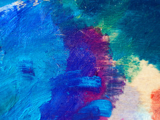 Strokes of oil paint of azure, blue and violet colors on the palette
