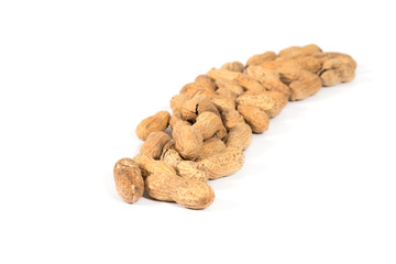 Raw tasty peanuts on white background