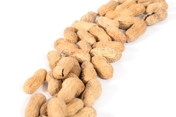 Raw tasty peanuts on white background