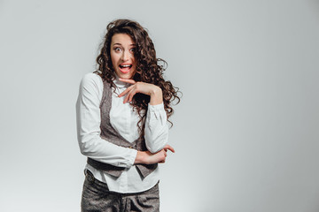 Portrait of attractive business woman on white background. With plenty of copy space. With a beautiful curly hair.