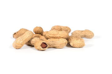 Raw tasty peanuts on white background
