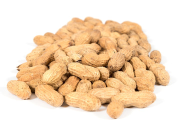 Raw tasty peanuts on white background