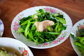 Stir Fry Chinese Kale with Oyster Sauce Recipe on a plate for Chinese new year, Chinese Ghost Festival.