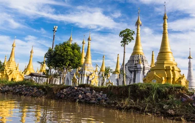 Foto op Canvas white and gold pagodas and stupas along the river canal leaving Indein on Lake Inle, Myanmar, Burma © vermontalm