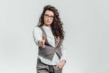 Funny portrait of an excited woman in glasses sunglasses. Close-up of a portrait of a young professional business woman makes the expression a funny face isolated on white background. Ready to