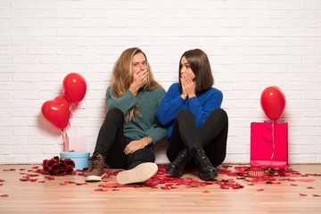 Couple in valentine day covering mouth with hands