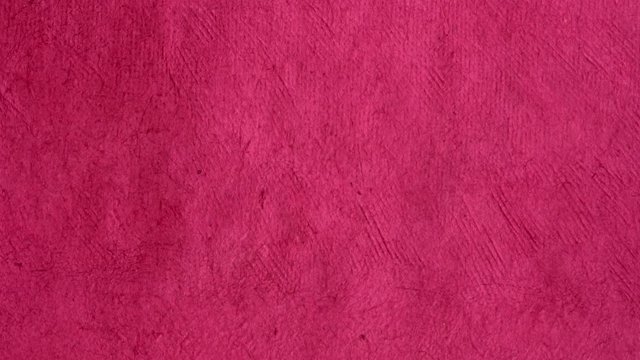 background of pink (rosa) handmade Huun paper created by Mayan artisans in Mexico from a tree bark - vertical pan