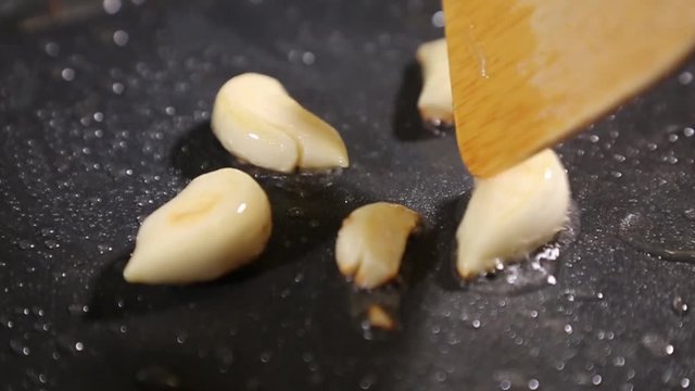 Onions and garlic fried in a frying pan