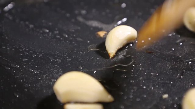 Onions and garlic fried in a frying pan
